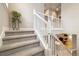 Bright staircase with white railing, leading to an upper level at 6334 N Dayton Way, Denver, CO 80238