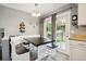 Cozy breakfast nook with bench seating and a view of the backyard through large glass windows at 4502 S Gar Way, Littleton, CO 80123