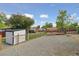 Backyard has both a gravel area and a grassy area, storage shed, patio and RV parking at 45 S Reed St, Lakewood, CO 80226