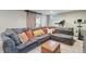 Finished basement featuring comfortable seating, an entertainment area, and workout equipment for relaxation and wellness at 45 S Reed St, Lakewood, CO 80226