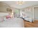 Comfortable bedroom featuring warm colors, hardwood floors, and stylish decor at 45 S Reed St, Lakewood, CO 80226