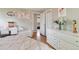 Bedroom view with hardwood floors, decorative desk and dresser, and soft lighting at 45 S Reed St, Lakewood, CO 80226