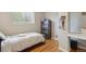 This charming bedroom features a twin bed, wood floors and a built-in desk space for studying and organization at 45 S Reed St, Lakewood, CO 80226