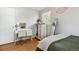 Well-lit bedroom featuring a desk, drawers, and a mirror that adds charm to this relaxing space at 45 S Reed St, Lakewood, CO 80226