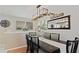 Bright dining room features a decorative light fixture, large mirror, and modern decor at 45 S Reed St, Lakewood, CO 80226