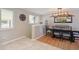 Stylish dining room with modern lighting, a decorative mirror, and a view to the outside at 45 S Reed St, Lakewood, CO 80226