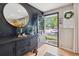 Stylish entryway featuring a modern console table and a view of the inviting outdoors at 45 S Reed St, Lakewood, CO 80226