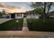 Inviting exterior view with a lush lawn and a charming entrance leading to the front door at 45 S Reed St, Lakewood, CO 80226