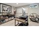 The home office features a standing desk and a large shelf with decor and books on display at 45 S Reed St, Lakewood, CO 80226