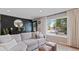 Cozy living room with a comfortable sofa and a serene view from the bright window at 45 S Reed St, Lakewood, CO 80226