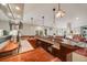 Basement bar with custom wood details, lighting, cabinetry, and glass storage at 1221 Havenwood Way, Castle Pines, CO 80108