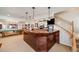 Finished basement with a custom bar, pool table, and staircase at 1221 Havenwood Way, Castle Pines, CO 80108