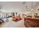 Spacious basement featuring a custom bar, gym, and sitting area at 1221 Havenwood Way, Castle Pines, CO 80108