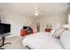 Spacious bedroom featuring carpet floors and a ceiling fan at 1221 Havenwood Way, Castle Pines, CO 80108