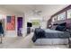 Bedroom with an ensuite bathroom, ceiling fan and views to the outside at 1221 Havenwood Way, Castle Pines, CO 80108