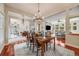 Dining area with an open layout, stylish chandelier, and easy access to the living spaces at 1221 Havenwood Way, Castle Pines, CO 80108