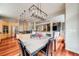The dining area with a modern light fixture is conveniently adjacent to the kitchen and living room at 1221 Havenwood Way, Castle Pines, CO 80108