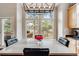 Dining area with natural light offers a view to the outdoor deck at 1221 Havenwood Way, Castle Pines, CO 80108