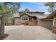 Charming two-story home with a well-manicured lawn and mature trees creating curb appeal at 1221 Havenwood Way, Castle Pines, CO 80108