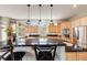 Large kitchen with granite countertops, stainless steel appliances, and plenty of cabinet space at 1221 Havenwood Way, Castle Pines, CO 80108