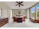 Spacious primary bedroom featuring a ceiling fan and an ensuite bathroom at 1221 Havenwood Way, Castle Pines, CO 80108