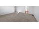 A comfortable bedroom with neutral carpet and a glimpse of the en-suite bathroom at 3869 N Shawee St, Aurora, CO 80019