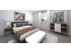 Stylishly staged bedroom with a blue bed frame, matching side tables, and decor at 3869 N Shawee St, Aurora, CO 80019
