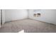 Spacious bedroom with neutral carpet and a large window at 3869 N Shawee St, Aurora, CO 80019