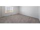 Bedroom boasts plush carpeting and a window with blinds at 3869 N Shawee St, Aurora, CO 80019