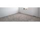 Simple bedroom with gray carpeting and a window at 3869 N Shawee St, Aurora, CO 80019
