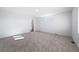 A bright bedroom featuring plush gray carpeting and two windows providing natural light at 3869 N Shawee St, Aurora, CO 80019