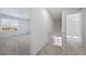 Hallway featuring gray carpet and access to two rooms at 3869 N Shawee St, Aurora, CO 80019