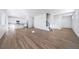 Bright and airy living room featuring hardwood floors and an open floor plan with white paint throughout at 3869 N Shawee St, Aurora, CO 80019