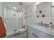 Updated bathroom featuring a glass-enclosed shower, modern vanity, and bright lighting at 8335 Fairmount Dr # 2-105, Denver, CO 80247