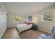 Serene bedroom features light hardwood floors, large windows and closet at 8335 Fairmount Dr # 2-105, Denver, CO 80247