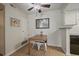Charming dining area features hardwood floors and a view of the kitchen at 8335 Fairmount Dr # 2-105, Denver, CO 80247