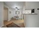 Bright dining area adjacent to the kitchen, featuring a ceiling fan and hardwood floors at 8335 Fairmount Dr # 2-105, Denver, CO 80247