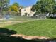 Well-maintained dog run area with grassy lawn and secure fencing at 8335 Fairmount Dr # 2-105, Denver, CO 80247