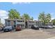 Exterior view of multi-story apartments with parking at 8335 Fairmount Dr # 2-105, Denver, CO 80247
