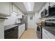 Charming kitchen with stainless appliances, modern countertops, and bright subway tile backsplash at 8335 Fairmount Dr # 2-105, Denver, CO 80247