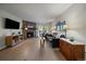 Inviting living room with a stone fireplace, hardwood floors, and access to an outdoor balcony at 8335 Fairmount Dr # 2-105, Denver, CO 80247
