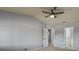 Spacious bedroom with neutral carpet, a ceiling fan, and multiple closets and doorways at 7131 S Wenatchee Way # C, Aurora, CO 80016