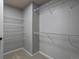 Walk-in closet with shelving for clothing and storage at 7131 S Wenatchee Way # C, Aurora, CO 80016