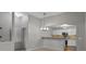 Open dining area featuring pendant lighting and a seamless transition to the updated kitchen at 7131 S Wenatchee Way # C, Aurora, CO 80016