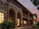 Exterior elevation showing a two-story condo building with a facade of siding and stone at 7131 S Wenatchee Way # C, Aurora, CO 80016