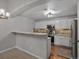 Modern kitchen with stainless steel appliances, granite countertops, and white cabinets at 7131 S Wenatchee Way # C, Aurora, CO 80016