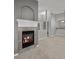 Cozy living room featuring a tiled fireplace with a decorative white mantel at 7131 S Wenatchee Way # C, Aurora, CO 80016