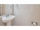Half bathroom features a pedestal sink and neutral wall color at 2514 Sweet Wind Ave, Castle Rock, CO 80109