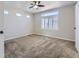 Carpeted bedroom with a ceiling fan and large window with shutters at 2514 Sweet Wind Ave, Castle Rock, CO 80109