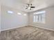 Carpeted bedroom featuring a ceiling fan and window with plantation shutters at 2514 Sweet Wind Ave, Castle Rock, CO 80109